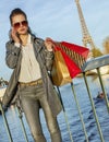 Fashion-monger with shopping bags speaking on mobile in Paris Royalty Free Stock Photo