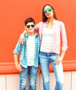 Fashion mother with son teenager in a sunglasses, checkered shirt Royalty Free Stock Photo