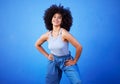 Fashion, natural hair and black woman isolated on a blue background for gen z, youth or cool portrait with mockup. Afro Royalty Free Stock Photo