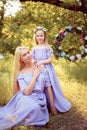 fashion outdoor photo of beautiful family look. beautiful mother