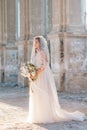 Pretty bride woman in elegant white lace dress with wedding bouquet Royalty Free Stock Photo