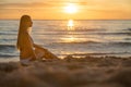 Fashion outdoor photo of sexy beautiful girl with blonde hair in elegant white bikini relaxing on sunset beach Royalty Free Stock Photo