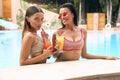 Women in elegant swimming suit relaxing near swimming pool Royalty Free Stock Photo