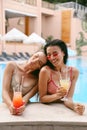 Women in elegant swimming suit relaxing near swimming pool Royalty Free Stock Photo