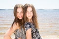 Outdoor photo of two beautiful young girls Beauty portrait of twins sisters Royalty Free Stock Photo