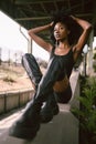 Fashion outdoor street style portrait Beautiful young African American woman posing outside on urban city landscape Royalty Free Stock Photo