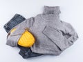 Fashion outfit with gray turtle neck, yellow bag Royalty Free Stock Photo