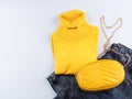 Fashion outfit with turtle neck and yellow bag Royalty Free Stock Photo