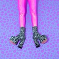 Fashion Party Girl in pink glitter leggins and zebra boots. Club Disco style 90s. Minimal concept