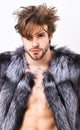 Fashion and pathos. Richness and luxury lifestyle. sleepy rich macho tousled hair fur vest on white background. Guy Royalty Free Stock Photo