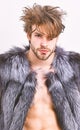 Fashion and pathos. Richness and luxury lifestyle. Sexy sleepy rich macho tousled hair fur vest on white background. Guy Royalty Free Stock Photo