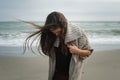 Fashion pensive woman portrait walking alone on a sea beach Royalty Free Stock Photo