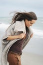 Fashion pensive woman portrait walking alone on a sea beach Royalty Free Stock Photo