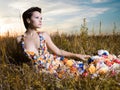 Fashion photo of beautiful lady in dress of flowers