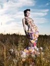 Fashion photo of beautiful lady in dress of flowers