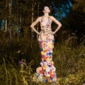 Fashion photo of beautiful lady in dress of flowers