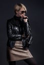 Fashion photo of beautiful lady in leather jacket and slirt with
