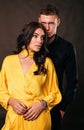 Valentine day. Beautiful woman with dark hair posing with handsome man in elegant clothes Royalty Free Stock Photo
