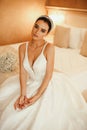 Beautiful sensual bride with dark hair in luxurious wedding dress and accessories Royalty Free Stock Photo