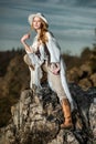 Fashion photo of beautiful woman at mountain Royalty Free Stock Photo