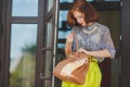 Fashion photo of beautiful young woman with bag. Royalty Free Stock Photo