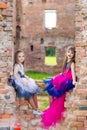 Fashion photo of two beautiful girls on a background of brick ru Royalty Free Stock Photo