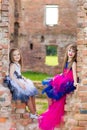 Fashion photo of two beautiful girls on a background of brick ru Royalty Free Stock Photo