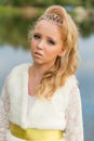 Fashion photo of a young girl in a beautiful white dress