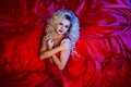 Fashion photo of young magnificent woman in red dress. Studio portrait Royalty Free Stock Photo