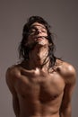 Fashion photography nude body young man model wet long hair Royalty Free Stock Photo