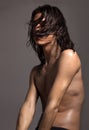 Fashion photography nude body young man model wet long hair Royalty Free Stock Photo