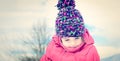 Fashion portait of a little girl in winter clothes having fun in Royalty Free Stock Photo