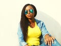 Fashion portrait of african woman in sunglasses over white Royalty Free Stock Photo