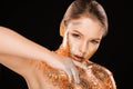 Fashion portrait of amazing blonde girl with golden foil on her Royalty Free Stock Photo