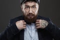 Fashion Portrait of bearded man in suit.old Hipster boy.handsome man in hat.Brutal Royalty Free Stock Photo