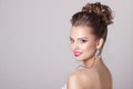 Fashion portrait of a beautiful attractive girl with a gentle elegant evening wedding hairstyles high and bright make-up with flow Royalty Free Stock Photo