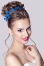 Fashion portrait of a beautiful attractive girl with a gentle elegant evening wedding hairstyles high and bright make-up with flow Royalty Free Stock Photo