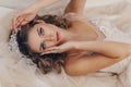 Beautiful bride with blond hair in luxurious wedding dress and accessories Royalty Free Stock Photo