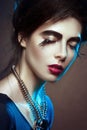 Fashion-portrait of the beautiful girl. Stylish make-up.