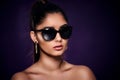 fashion portrait of beautiful Indian woman who wearing sunglasses and earrings. Asian glamour Royalty Free Stock Photo