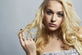 Fashion portrait of Beautiful woman.Flirt Blond Girl with Curly hair Royalty Free Stock Photo