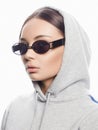 Fashion portrait of Beautiful woman in sunglasses and hood Royalty Free Stock Photo