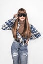 Fashion portrait of beautiful young girl with smooth hair. Girl in blouse and jeans. Clothing and hairstyle. Teenager with Royalty Free Stock Photo