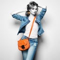 Fashion portrait of beautiful young woman with handbag Royalty Free Stock Photo