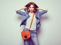 Fashion portrait of beautiful young woman with handbag Royalty Free Stock Photo