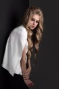 Fashion portrait of blonde woman dressed white jacket