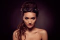 Fashion portrait of brown-eyes woman. Gold tiara. Orange yellow Royalty Free Stock Photo