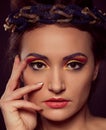 Fashion portrait of brown-eyes woman. Gold tiara. Orange yellow Royalty Free Stock Photo