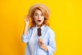 Fashion portrait cool young woman with ice cream over yellow background. Young cheeky hipster girl eating an ice cream Royalty Free Stock Photo