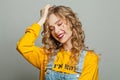 Fashion portrait of cute young woman with long blonde curly hair Royalty Free Stock Photo